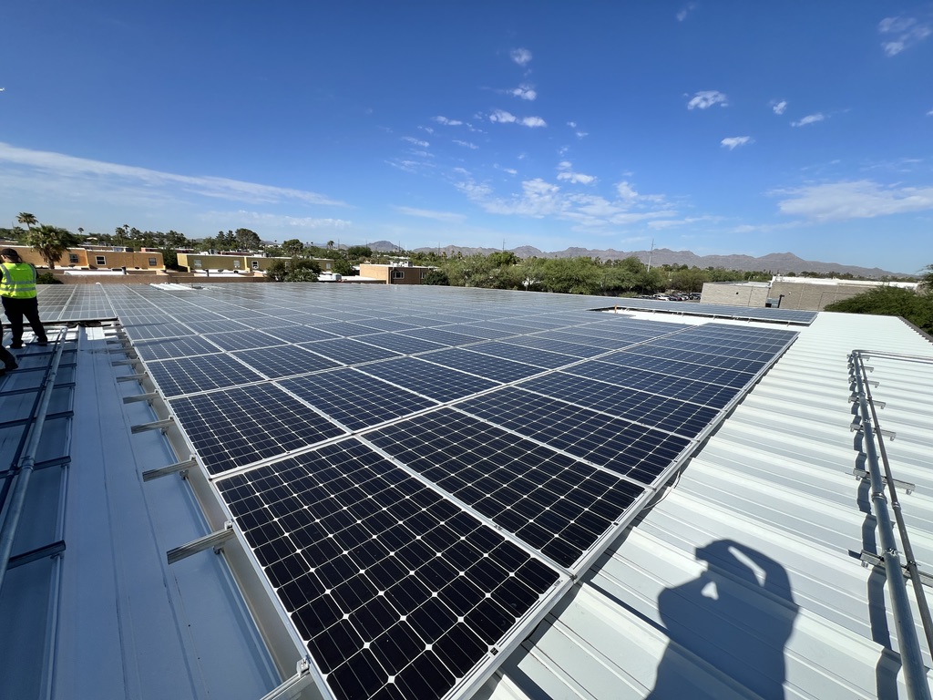 ETS crew performing full system removal and replacement at commercial rooftop solar site in Arizona